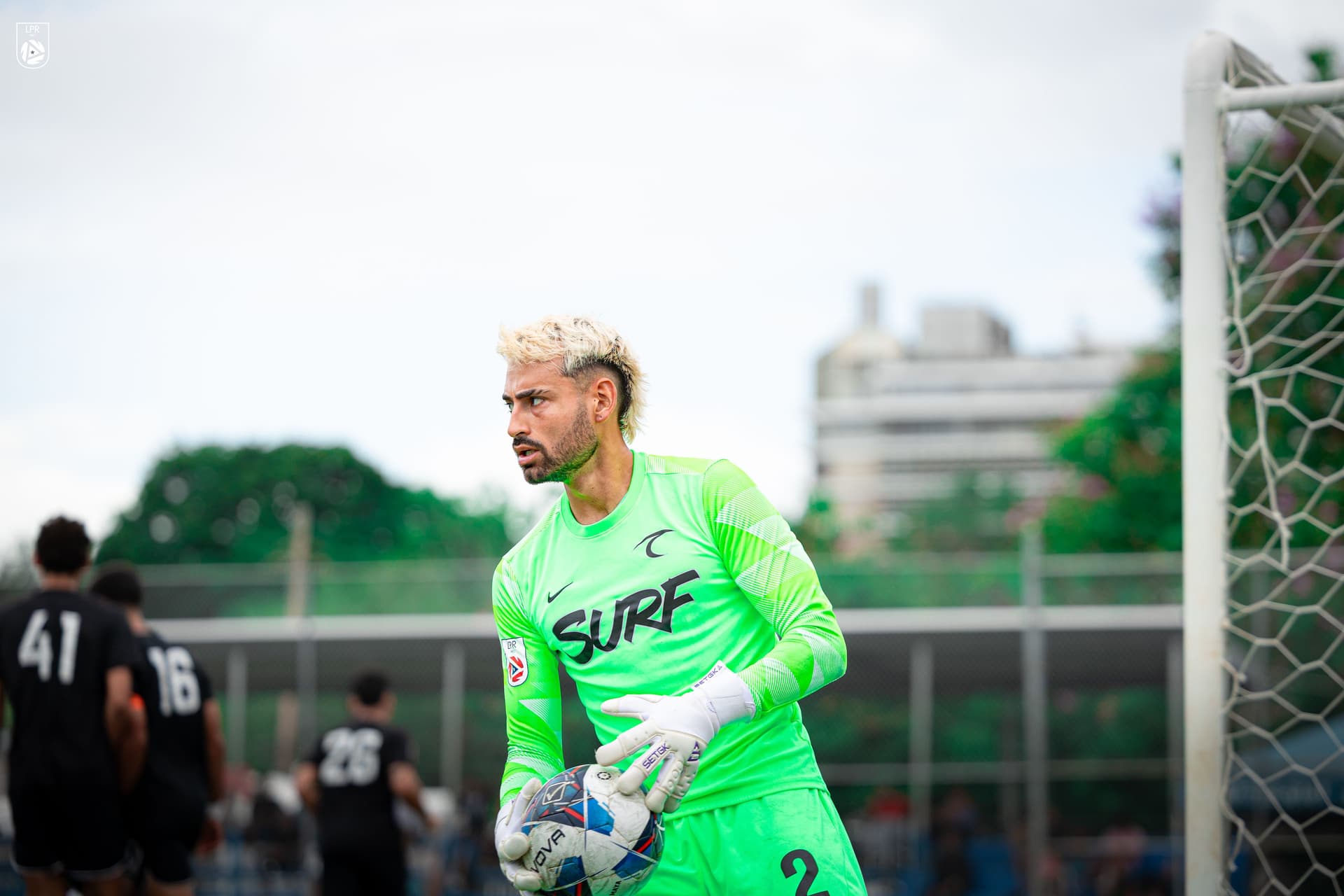 Lucas Espada in goal, holding the ball during a match